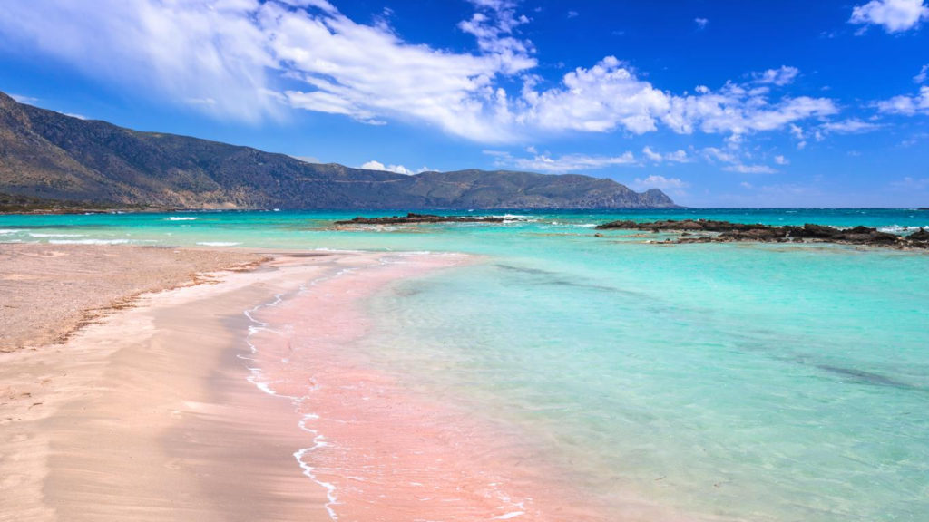 Elafonissi Beach is one of the most beautiful beaches in Crete, known for its pink-tinged sand and crystal-clear waters