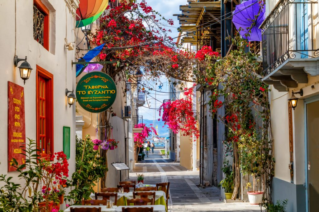 Nafplio’s Old Town is a delightful maze of narrow streets, neoclassical buildings, and colorful bougainvillea draped over balconies