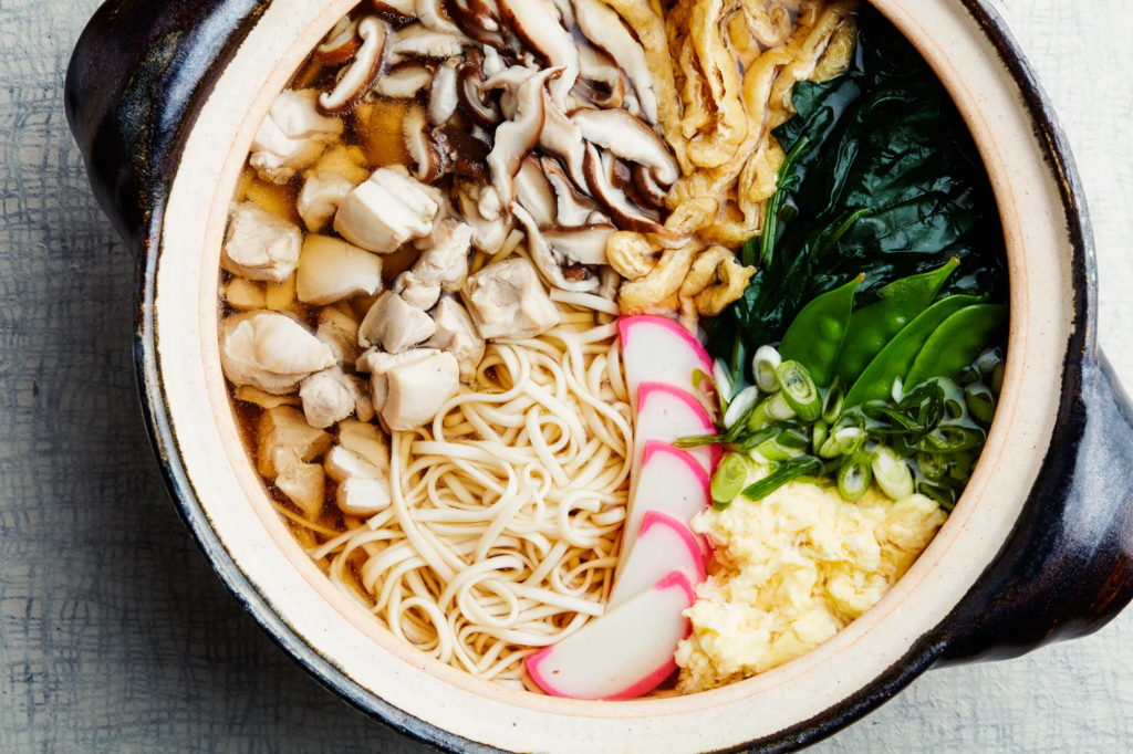 Udon are thick, chewy wheat noodles often served in a hot, flavorful broth