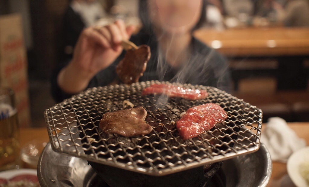 Yakiniku, which means "grilled meat," is a popular dining option in Japan where diners cook their own meat and vegetables on a grill at their table