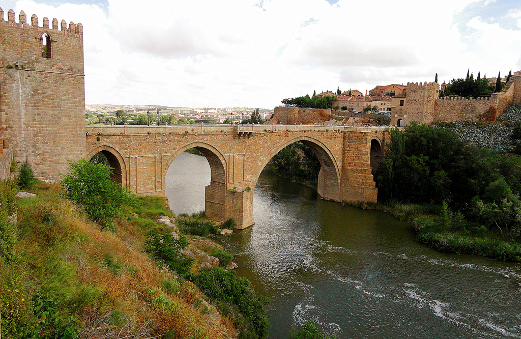 The Puente de San Martín is a medieval bridge that spans the Tagus River, offering stunning views of Toledo’s skyline and the surrounding landscape. Built in the 14th century