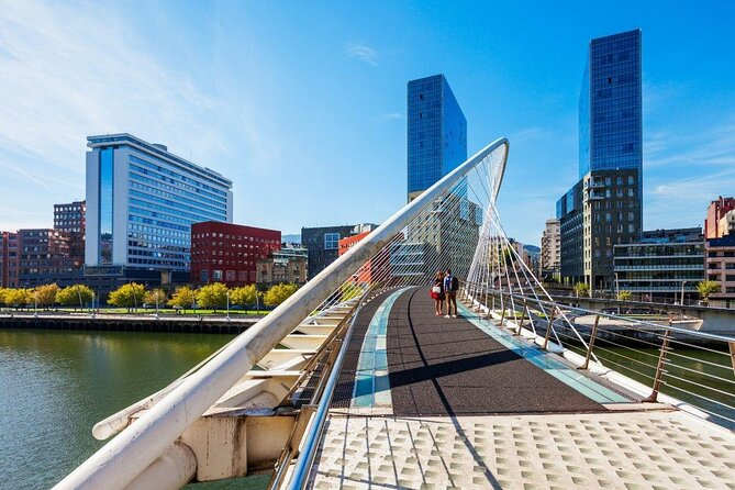 The Zubizuri Bridge, designed by architect Santiago Calatrava, is a striking white footbridge that spans the Nervión River