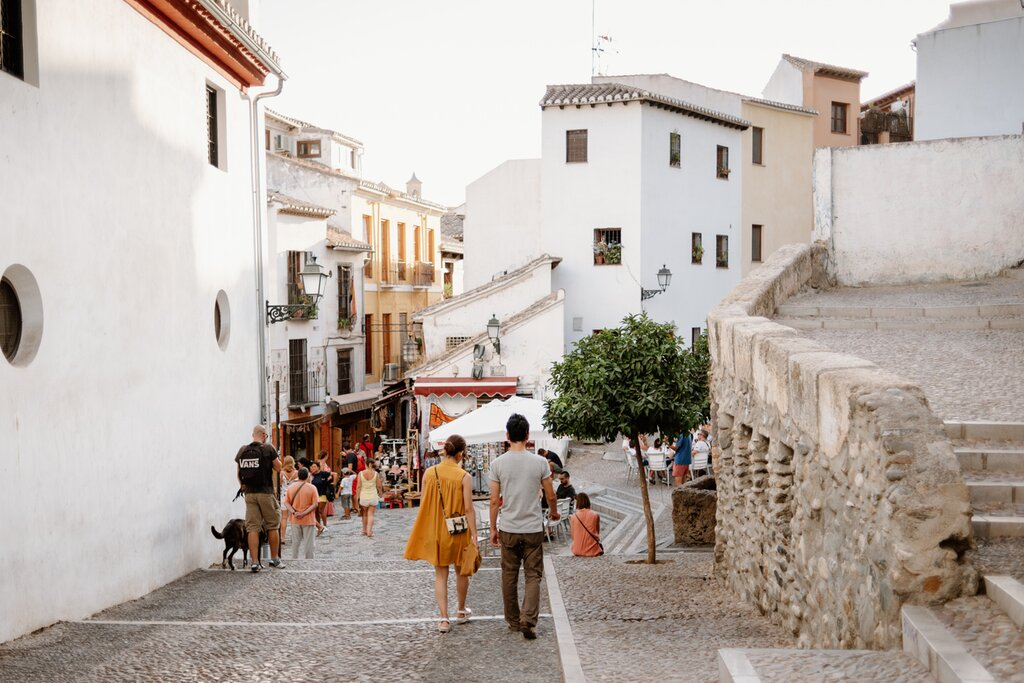 The Albaicín is Granada’s old Moorish quarter, characterized by its narrow, winding streets, whitewashed houses, and stunning views of the Alhambra