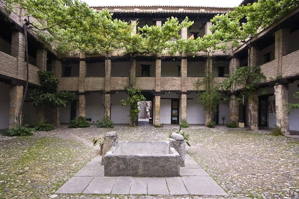 Corral del Carbón is a historic building in Granada that dates back to the 14th century. Originally a warehouse and inn for merchants, it is now used as a cultural center and event space.