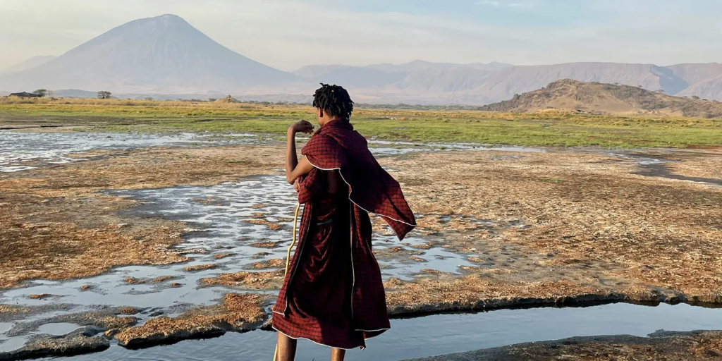 The landscape around Lake Natron is otherworldly and awe-inspiring. Surrounded by the Rift Valley escarpment and the active Ol Doinyo Lengai volcano